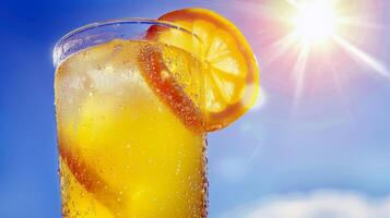 Refreshing glass of lemonade, condensation glistening in the summer heat photo