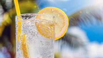 Refreshing glass of lemonade, condensation glistening in the summer heat photo