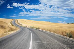 Road trip through country roads, surrounded by fields of sun-kissed crops in the height of summer photo