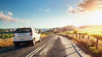 Road trip through country roads, surrounded by fields of sun-kissed crops in the height of summer photo