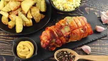 boneless meat roulade with seasonings and garnish. Country style food. video