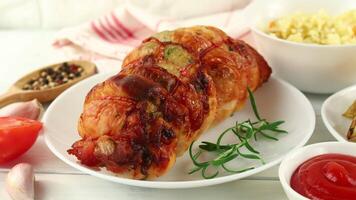 boneless meat roulade with seasonings and garnish. video