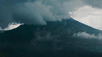 Aerial view black solidified lava flows around active volcano Mount Batur video