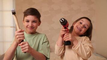 Children help make repairs in an apartment, room, house. construction tools video