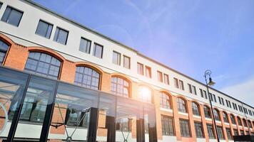 Modern office building with white metallic panel facade and windows. Modern architectural details. photo