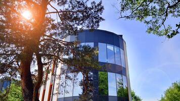 Modern office building with white metallic panel facade and windows. Modern architectural details. photo