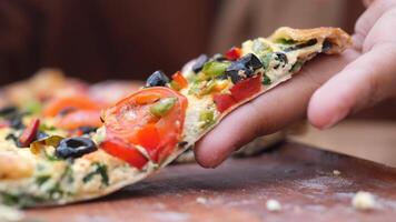closeup of woman hand pick a Slice of pizza video