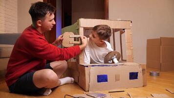 father and son make a car out of cardboard video