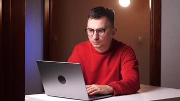 Stressed young man in glasses due to computer overwork sedentary work lifestyle video