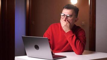 Sad shocked stressed man with glasses worker freelancer reading bad news video