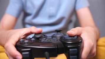 Using controller playing games - close up of hands and joypad video