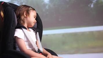 little girl sleeping in a safe baby car seat, girl fell asleep on time travel video