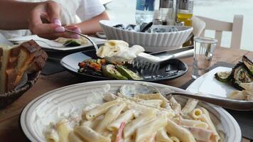 pesto spicy seafood spaghetti on plate Spoon pasta Carbonara with seafood video