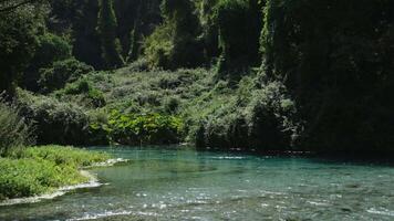 50 meters deep in The Blue eye or Syri i kalter, a natural phenomenon in the mountains of southern Albania video