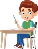 niño pequeño de dibujos animados estudiando en el escritorio vector