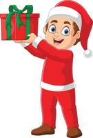 Cartoon little boy in red clothes holding a gift vector