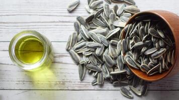 sunflower oil seed and oil in a container on table video