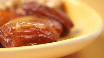 close up of fresh date fruit in a bowl on table video