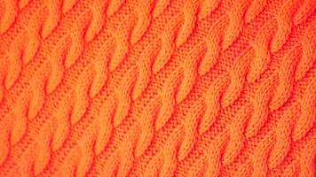 orange color knitted fabric cloth surface . video