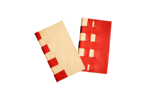 Traditional binding with red and yellow leather png