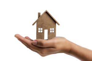 Hand holding a small simple house on isolated transparent background png