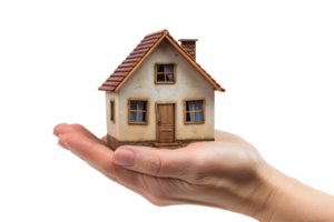 Hand holding a small simple house on isolated transparent background png