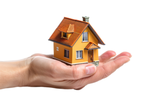 Hand holding a small simple house on isolated transparent background png