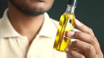 hand holding a bottle of olive oil video