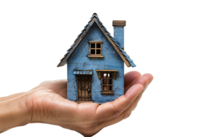 Hand holding a small simple house on isolated transparent background png