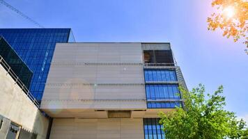Architectural facade building with of glass elements. Exterior of a modern industrial building. photo