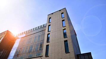 Modern office building detail. Perspective view of geometric angular concrete windows on the facade of a modernist brutalist style building. photo