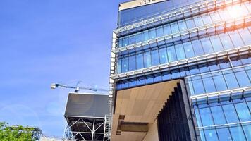 Architectural facade building with of glass elements. Exterior of a modern industrial building. photo