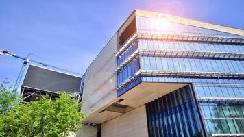 Architectural facade building with of glass elements. Exterior of a modern industrial building. photo