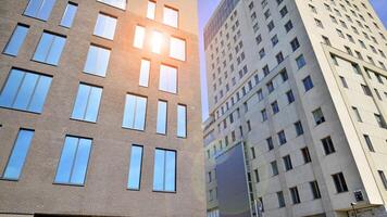 Modern office building detail. Perspective view of geometric angular concrete windows on the facade of a modernist brutalist style building. photo