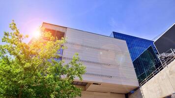 Architectural facade building with of glass elements. Exterior of a modern industrial building. photo