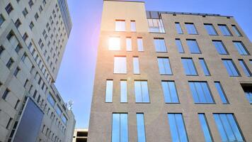 Modern office building detail. Perspective view of geometric angular concrete windows on the facade of a modernist brutalist style building. photo