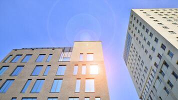 Modern office building detail. Perspective view of geometric angular concrete windows on the facade of a modernist brutalist style building. photo