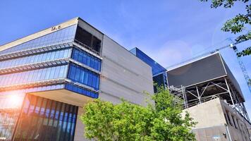 Architectural facade building with of glass elements. Exterior of a modern industrial building. photo