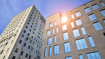 Modern office building detail. Perspective view of geometric angular concrete windows on the facade of a modernist brutalist style building. photo