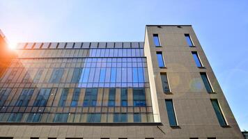 Modern office building detail. Perspective view of geometric angular concrete windows on the facade of a modernist brutalist style building. photo