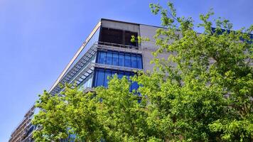 Architectural facade building with of glass elements. Exterior of a modern industrial building. photo