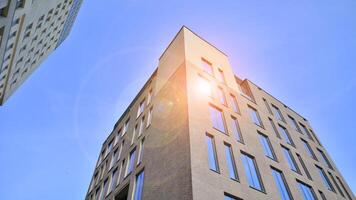 Modern office building detail. Perspective view of geometric angular concrete windows on the facade of a modernist brutalist style building. photo