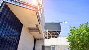 Architectural facade building with of glass elements. Exterior of a modern industrial building. photo