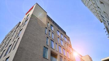 Modern office building detail. Perspective view of geometric angular concrete windows on the facade of a modernist brutalist style building. photo