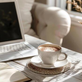 A cappuccino on a work table in a boho-style office photo