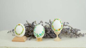 banner with lavender flowers and three eggs for easter embroidery threads on eggshell ornament handmade darling beautifully stylish place for text this is postcard envelope product packaging video