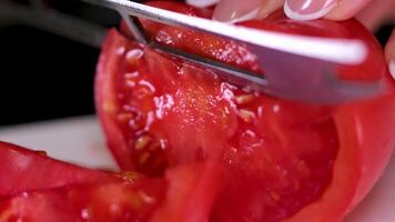 Slicing a beautiful, appetizing red tomato. video