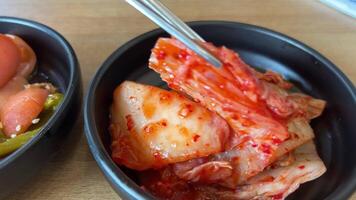 Tsukemono Japanese appetizer pickled cabbage with pepper Chilli Japanese traditional food, Vegetables salt pickled tsukemono in a dish on white background video