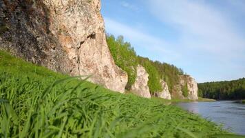 River Flanked by Cliff and Grass video