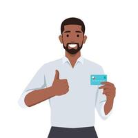 Young black businessman showing credit, debit, ATM card and making thumb up gesture sign. vector